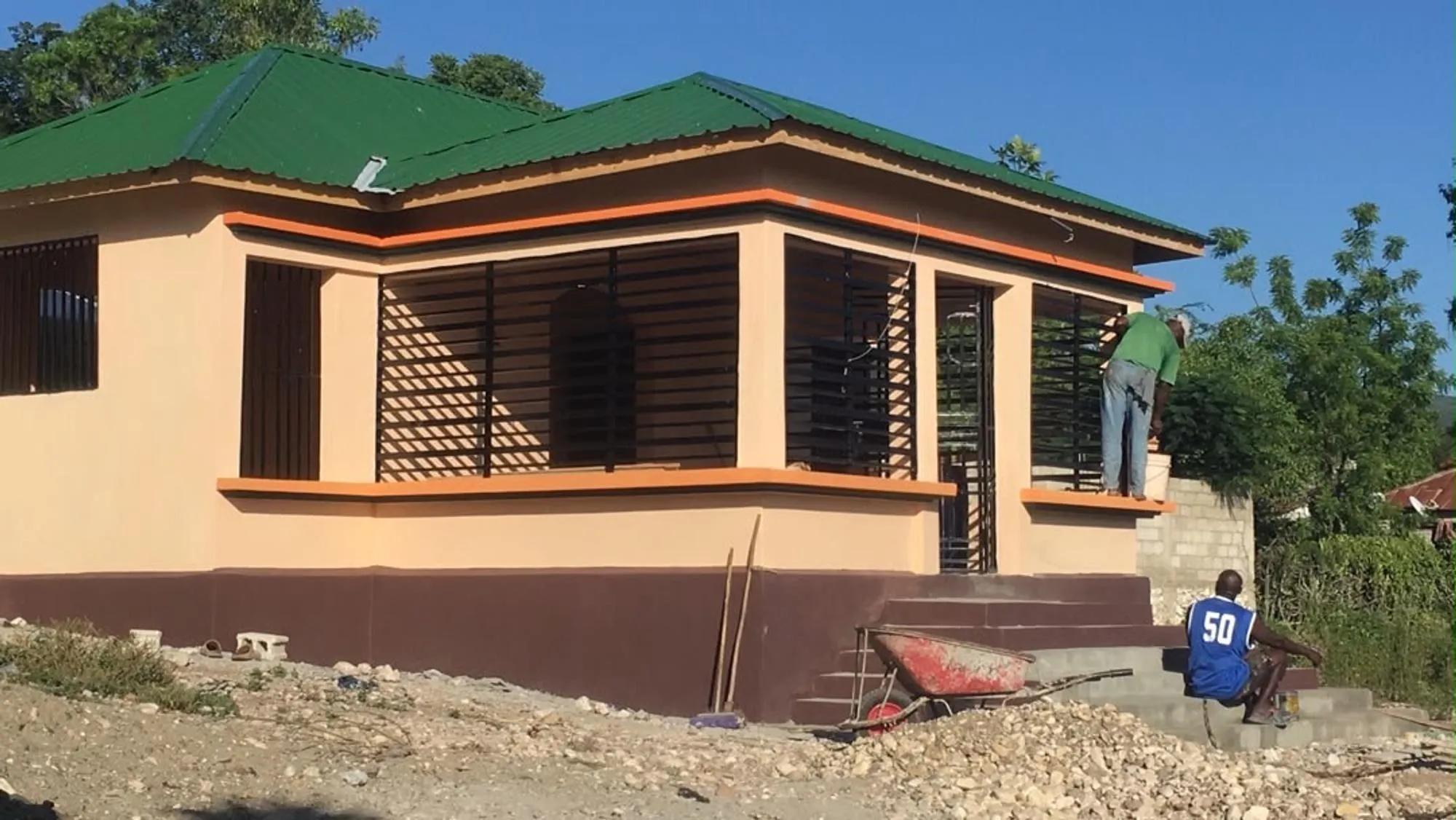 Workers finishing the new House of Hope counseling building in Deschapelles